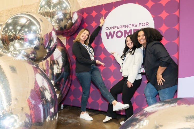 Pennsylvania Conference for Women 2024 attendees against gigantic silver balloon wall